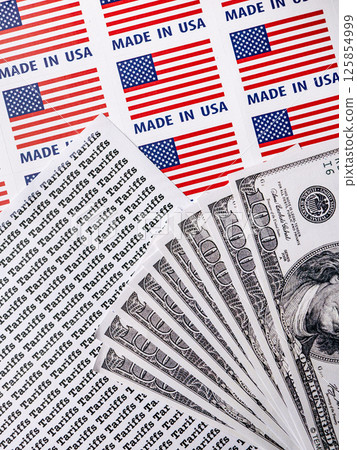 Words Tariffs Seamless print on paper with MADE IN USA Lable and Dollar Bill for trading export import business tax background. Words Tariffs Seamless print on paper with MADE IN USA Lable and Dollar Bill for trading export import business tax background. 125854999
