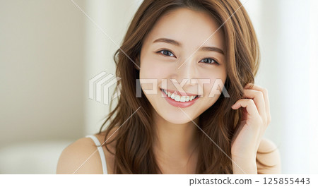 Young woman with beautiful hair blowing in the wind 125855443