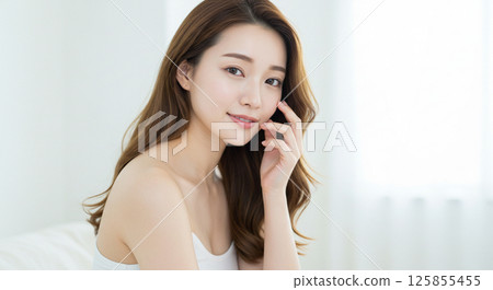 Young woman with beautiful hair blowing in the wind Young woman with beautiful hair blowing in the wind 125855455