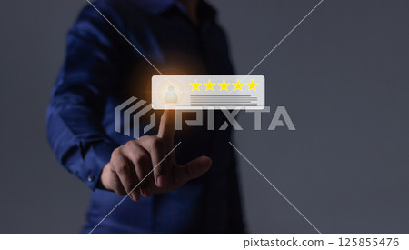 Young Man hand holding Smart Phone with five star to review and give 5 stars 125855476