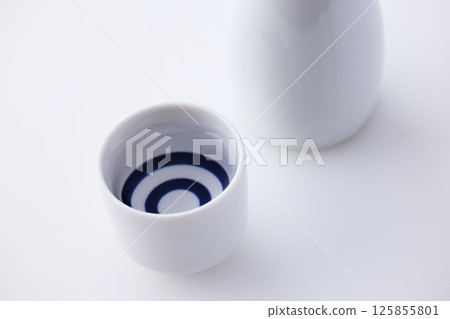 Sake poured into Ochoko 125855801
