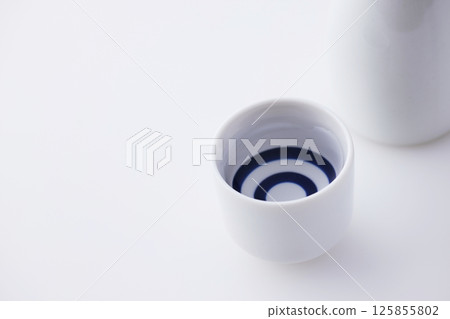 Sake poured into Ochoko 125855802