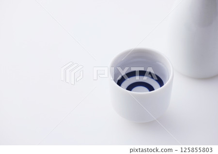 Sake poured into Ochoko 125855803