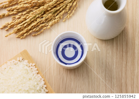 Sake poured into Ochoko Sake poured into Ochoko 125855942