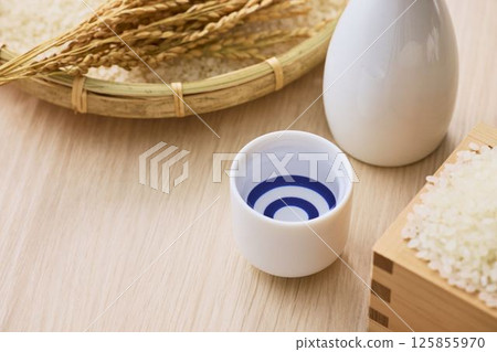 Sake poured into Ochoko 125855970