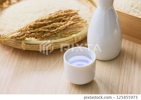 Sake poured into Ochoko 125855973
