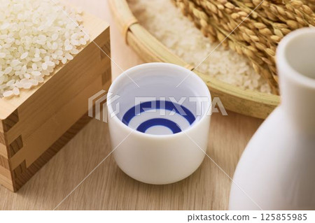 Sake poured into Ochoko Sake poured into Ochoko 125855985