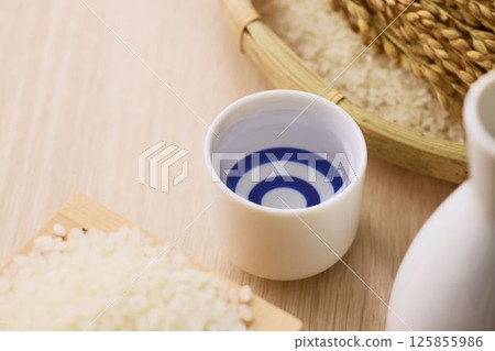 Sake poured into Ochoko 125855986