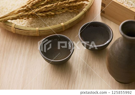 Sake poured into Ochoko 125855992