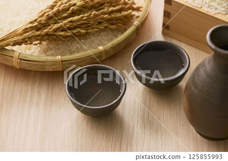 Sake poured into Ochoko 125855993
