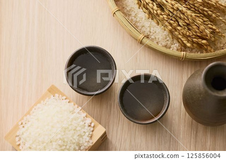 Sake poured into Ochoko Sake poured into Ochoko 125856004