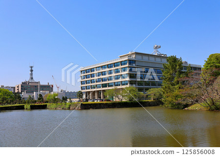 National treasure Matsue Castle tower, Matsue Castle stone wall, Shimane Prefectural Office seen from Horikawa River 125856008