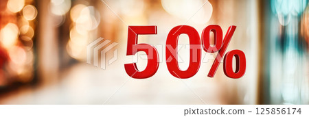 Red 50 percent sign with blurred lights in shopping mall background for seasonal promotion and discount advertising. 125856174