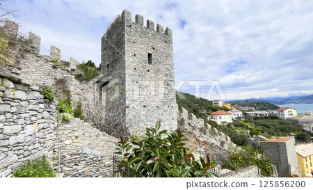 View of town from top of castle. Traditional buildings. Boats in town of Porto Venere, Liguria. Sea and tourism in Italy. Nature in mountains. View of town from top of castle. Traditional buildings. Boats in town of Porto Venere, Liguria. Sea and tourism in Italy. Nature in mountains. 125856200