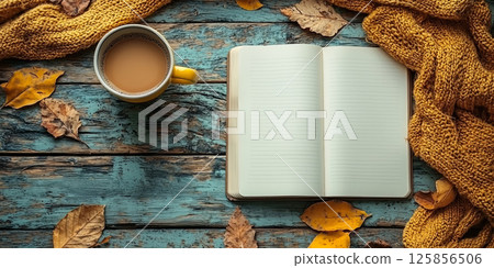 Planning concept with an empty notebook, coffee cup, and dried flowers, top view 125856506