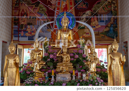 Nonthaburi, Thailand, March 15, 2025, Inside Wat Chimphli Sutthawat showcasing ornate decorations and golden statues in a serene atmosphere 125856620