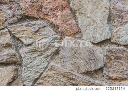 Structural stone wall of the ancient building of the last century. 125857134