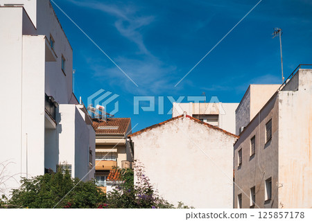 Urban skyline with buildings under a clear blue sky Urban skyline with buildings under a clear blue sky 125857178