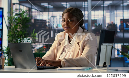 Powerful female entrepreneur focuses on strategic planning, setting a clear vision and goals for the corporation and aligning resources to achieve sustainable growth. Determination. Camera A. 125857299