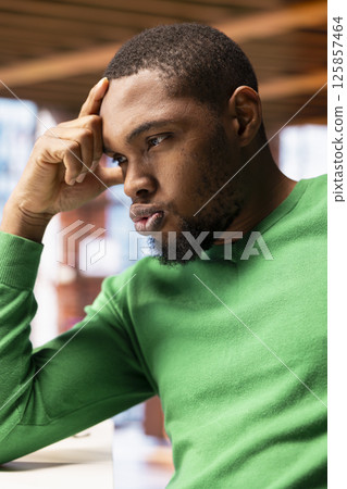 Irked man in apartment office sighing, upset after having to answer too many emails on laptop. Annoyed freelancer feeling overworked while typing on device keyboard, feeling frustration Irked man in apartment office sighing, upset after having to answer too many emails on laptop. Annoyed freelancer feeling overworked while typing on device keyboard, feeling frustration 125857464