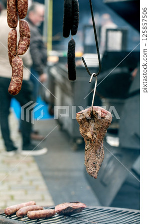 Cured Meats Hanging at Outdoor Market 125857506