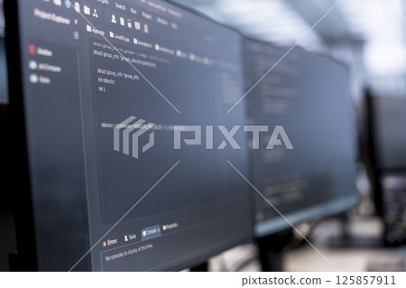 Close up of computers in data center running server rigs diagnostic tests and error checking utilities to identify and resolve software problems. PC software used to monitor critical systems 125857911
