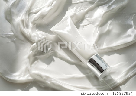 Top view beauty cosmetic tube white, silver color. Flowers, silk mockup template 125857954