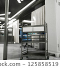 Sterile hospital lab with metal supply cart on wheels in organized clinical space. Advanced medical technology lab with with metallic sterile equipment storage, 3D render 125858519