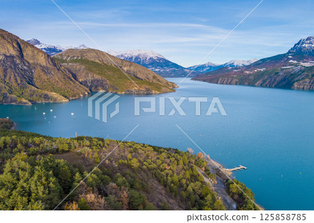 Mountain lake in autumn Aerial view. Serre-Poncon mountain lake in winter. Hautes Alpes, France Mountain lake in autumn Aerial view. Serre-Poncon mountain lake in winter. Hautes Alpes, France 125858785