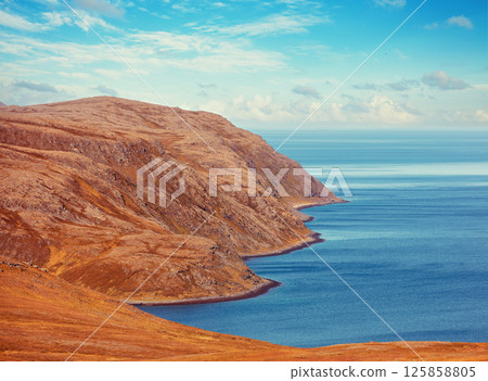Rocky Barents Sea coast. Beautiful landscape, wilderness. North Cape. Nordkapp, Norway Rocky Barents Sea coast. Beautiful landscape, wilderness. North Cape. Nordkapp, Norway 125858805