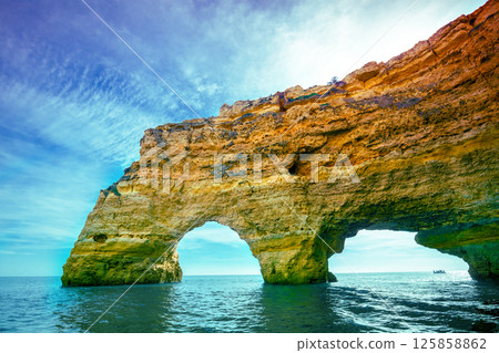 Coastal rocky seascape. View of Praia da Marinha beach and Benagil in Algarve region in the Atlantic Ocean. Portugal, Europe. Rock Elephant drinks water Coastal rocky seascape. View of Praia da Marinha beach and Benagil in Algarve region in the Atlantic Ocean. Portugal, Europe. Rock Elephant drinks water 125858862