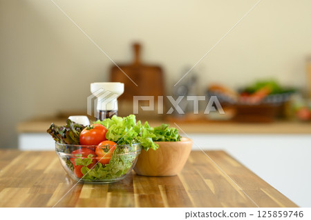Healthy ingredients for a homemade salad on a kitchen counter 125859746