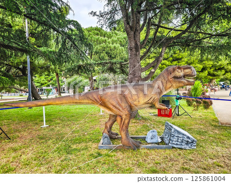 Feathered T-Rex and Dinosaurs in Summer Vacation Park 125861004