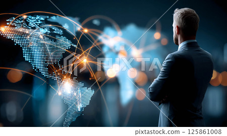 A man in a business suit, standing with his back to the viewer. In the foreground is an image of the world in the form of luminous dots connected by lines, symbolizing a global network A man in a business suit, standing with his back to the viewer. In the foreground is an image of the world in the form of luminous dots connected by lines, symbolizing a global network 125861008