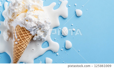 Ice cream in a waffle cone, lying on a light blue background. The ice cream has melted, and some of it has spread over the background. Ice cream in a waffle cone, lying on a light blue background. The ice cream has melted, and some of it has spread over the background. 125861009