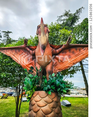 Feathered T-Rex and Dinosaurs in Summer Vacation Park 125861056