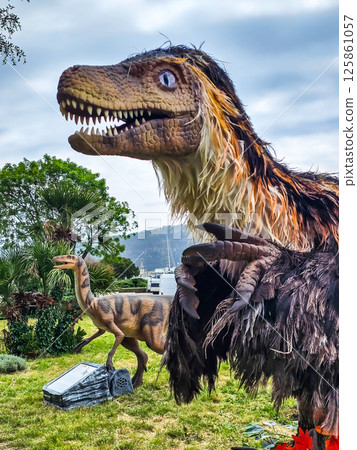 Feathered T-Rex and Dinosaurs in Summer Vacation Park 125861057