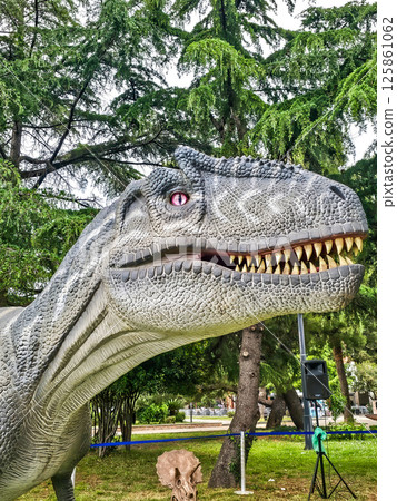 Feathered T-Rex and Dinosaurs in Summer Vacation Park 125861062