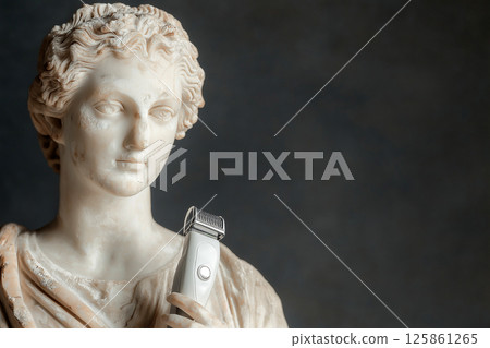 A classical marble sculpture of a woman holding an electric razor, ancient art and modern technology. Hairdresser's tool, haircut, hairstylist, hair loss 125861265