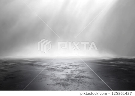 A clean and minimalist stage setup with dramatic overhead lighting against a dark backdrop, creating a moody and professional atmosphere. 125861427