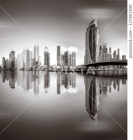 Skyscrapers and Urban city skyline over water, black and white style, city background, Dubai Marina bay UAE 125861890