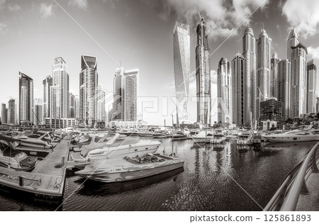 Skyscrapers and Urban city skyline over water, black and white style, city background, Dubai Marina bay UAE 125861893