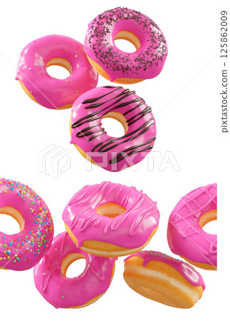 Donuts with pink fruit glaze, sprinkles, white drizzle, and dots isolated on white transparent background 125862009