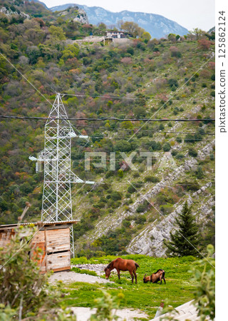 Power Station in the Middle of Mountain Landscape 125862124