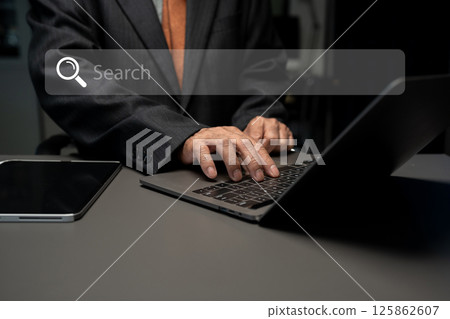 Male business clicking internet search page on computer touch screen in office. Male business clicking internet search page on computer touch screen in office. 125862607