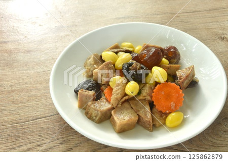 deep fried tofu and gluten with yellow ginkgo and pickled jujube couple black mushroom in soy sauce vegetarian food on plate deep fried tofu and gluten with yellow ginkgo and pickled jujube couple black mushroom in soy sauce vegetarian food on plate 125862879