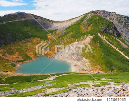 Mt. Norikura and Fusegaike Pond in autumn Mt. Norikura and Fusegaike Pond in autumn 125863065