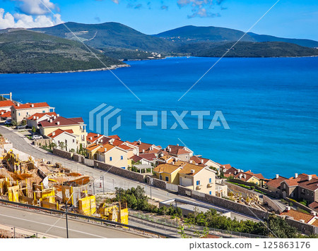 Lustica Bay with Colorful Houses, Marina, and Lighthouse, Montenegro Lustica Bay with Colorful Houses, Marina, and Lighthouse, Montenegro 125863176
