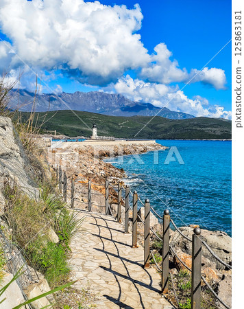 Lustica Bay with Colorful Houses, Marina, and Lighthouse, Montenegro Lustica Bay with Colorful Houses, Marina, and Lighthouse, Montenegro 125863181