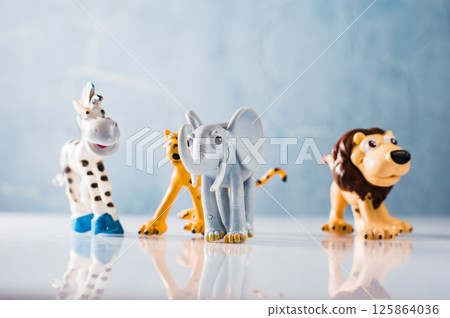 Funny plastic toys: zebra, lion, leopard and elephant. Funny plastic toys: zebra, lion, leopard and elephant. 125864036